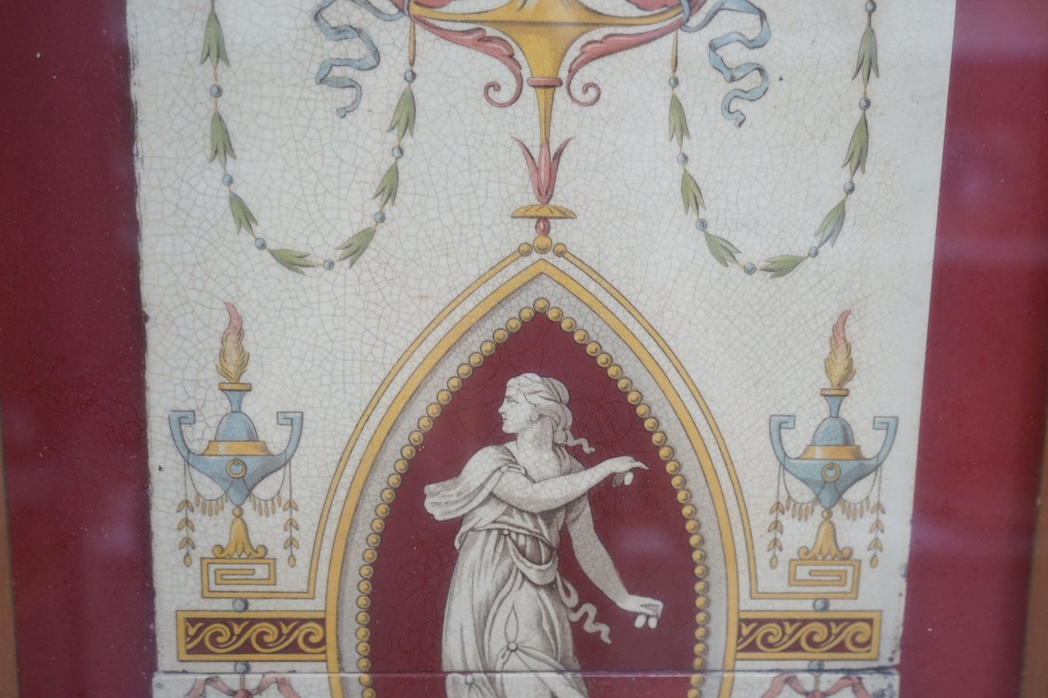 A late 19th century twin-tile panel, framed, tiles 20cm square